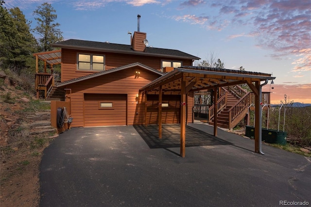 29 Cedar Ln, Bailey, CO 80421 - chalet / cabin with stairway, driveway, and a chimney