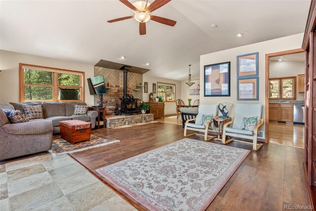29 Cedar Ln, Bailey, CO 80421 - living room with a wood stove, a ceiling fan, vaulted ceiling, wood finished floors, and recessed lighting