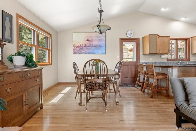 29 Cedar Ln, Bailey, CO 80421 - dining area with lofted ceiling, light wood finished floors, and baseboards