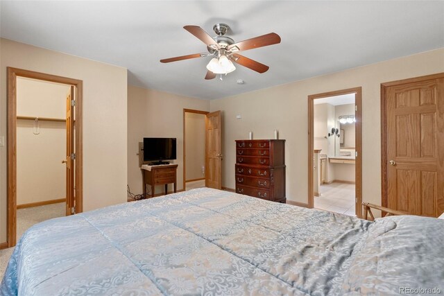 29 Cedar Ln, Bailey, CO 80421 - bedroom with baseboards, a spacious closet, a closet, a ceiling fan, and connected bathroom