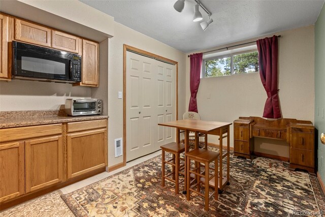 29 Cedar Ln, Bailey, CO 80421 - dining area with a textured ceiling and rail lighting