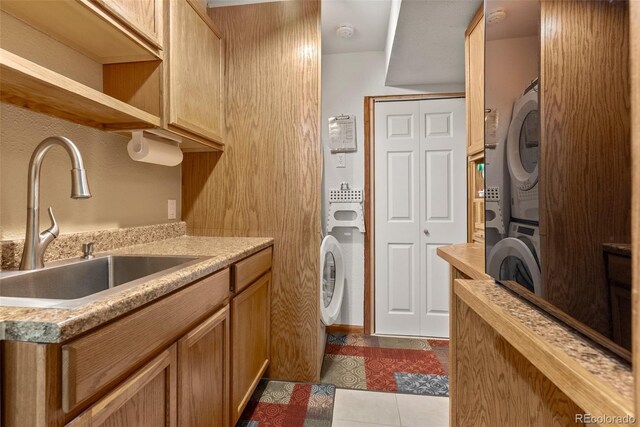 29 Cedar Ln, Bailey, CO 80421 - washroom featuring stacked washer / drying machine and dark tile patterned flooring