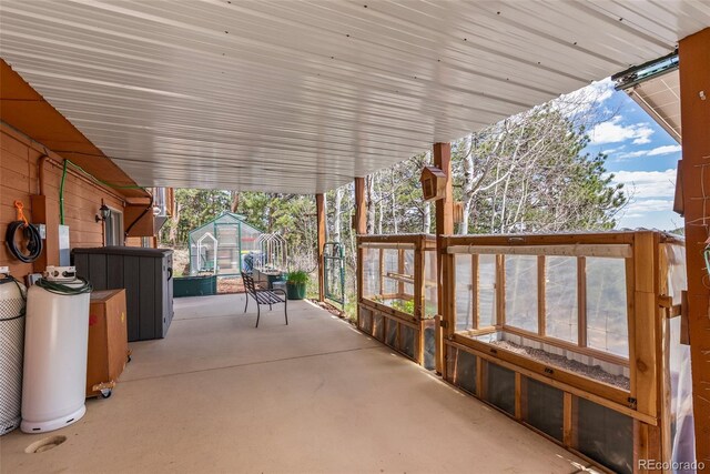 29 Cedar Ln, Bailey, CO 80421 - view of patio / terrace with a greenhouse and an outbuilding
