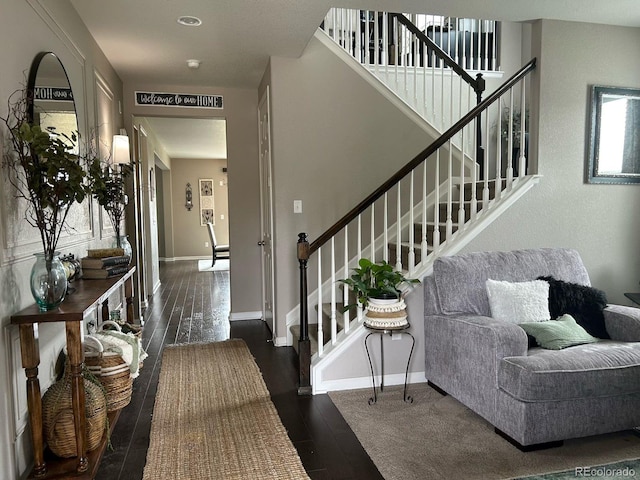 foyer entrance featuring dark hardwood / wood-style floors