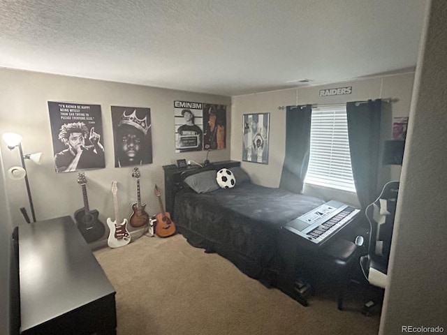 bedroom with carpet flooring and a textured ceiling