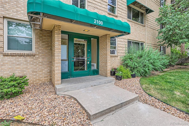 2100 N Franklin St Unit 20, Denver, CO 80205 - doorway to property featuring brick siding