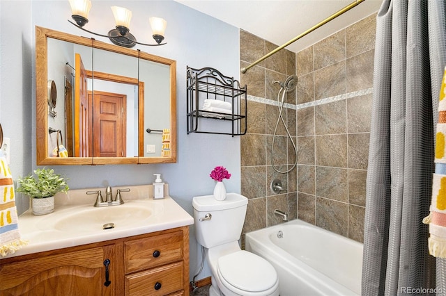 bathroom with toilet, shower / bath combo, and vanity