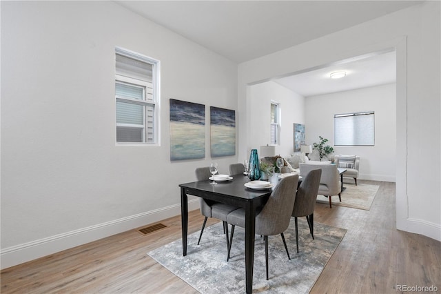 dining space featuring light hardwood / wood-style flooring