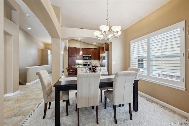 dining space featuring lofted ceiling, baseboards, recessed lighting, and a notable chandelier
