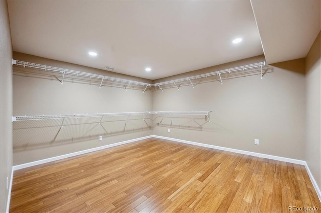 spacious closet with light wood-type flooring