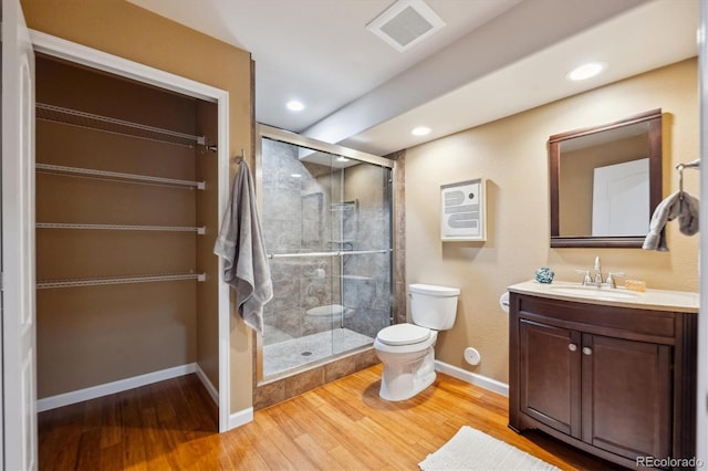 bathroom featuring visible vents, toilet, baseboards, and a stall shower