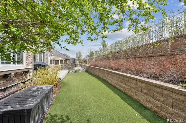 view of yard with a fenced backyard