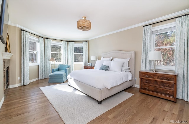 bedroom with crown molding and wood-type flooring