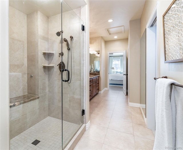 bathroom with vanity, an enclosed shower, and tile patterned flooring