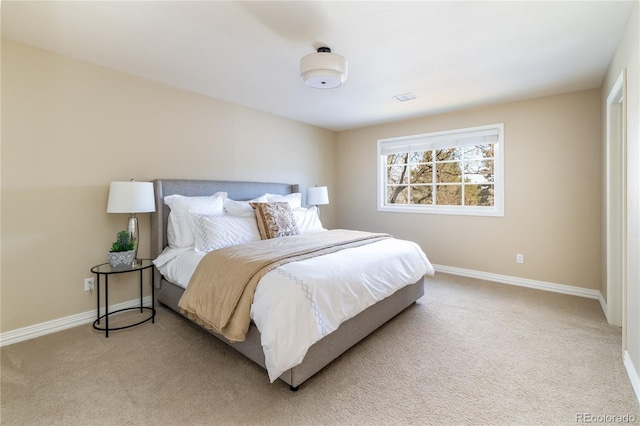 bedroom with light colored carpet