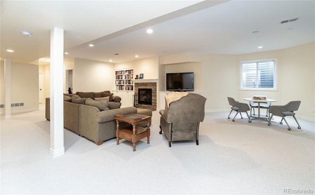 living room featuring built in shelves and light colored carpet