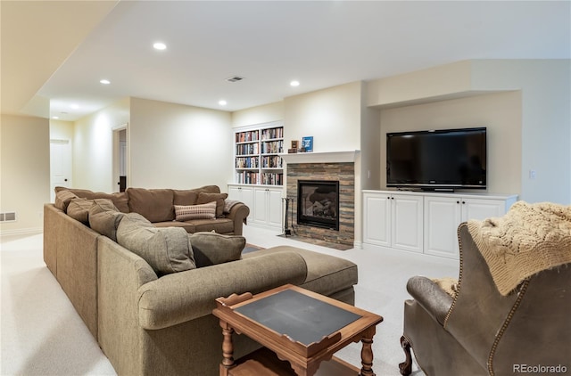 living room with light colored carpet and built in features