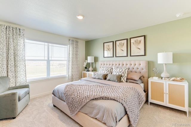 bedroom with carpet and baseboards