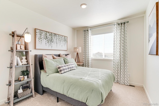 carpeted bedroom with baseboards