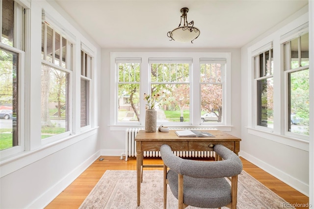 730 Cook St, Denver, CO 80206 - home office with healthy amount of natural light, light wood-style flooring, and baseboards