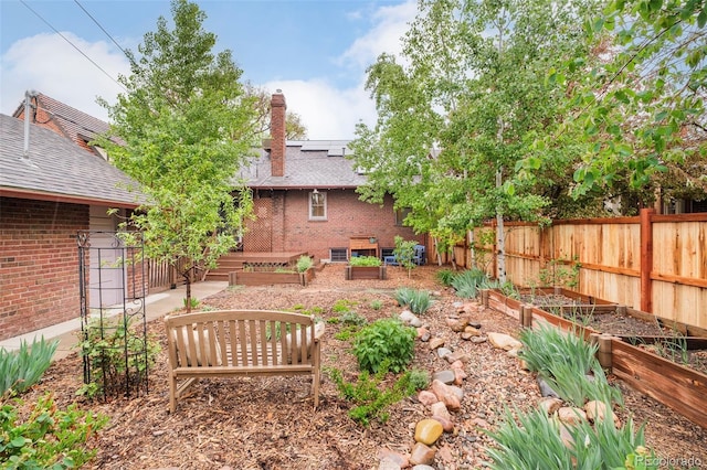 730 Cook St, Denver, CO 80206 - view of yard featuring a garden and fence