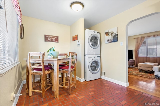 laundry area with stacked washer / drying machine