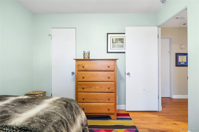 bedroom with light hardwood / wood-style flooring