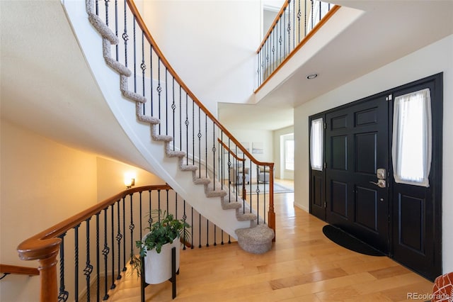 1881 Alma Ln, Superior, CO 80027 - entryway with wood finished floors, a high ceiling, and stairs