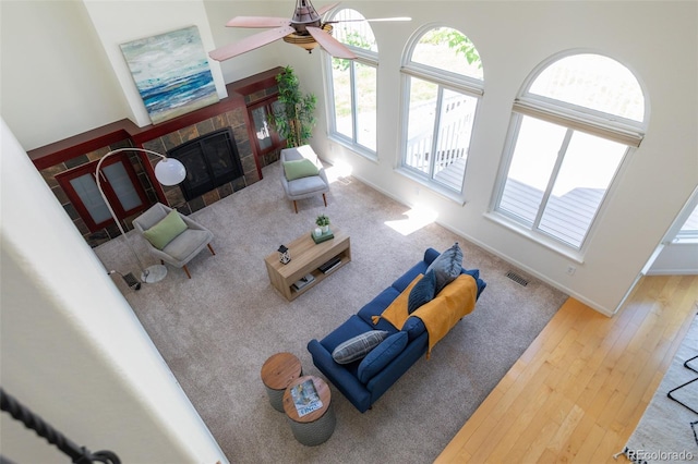 1881 Alma Ln, Superior, CO 80027 - living area with a fireplace, hardwood / wood-style flooring, and a ceiling fan