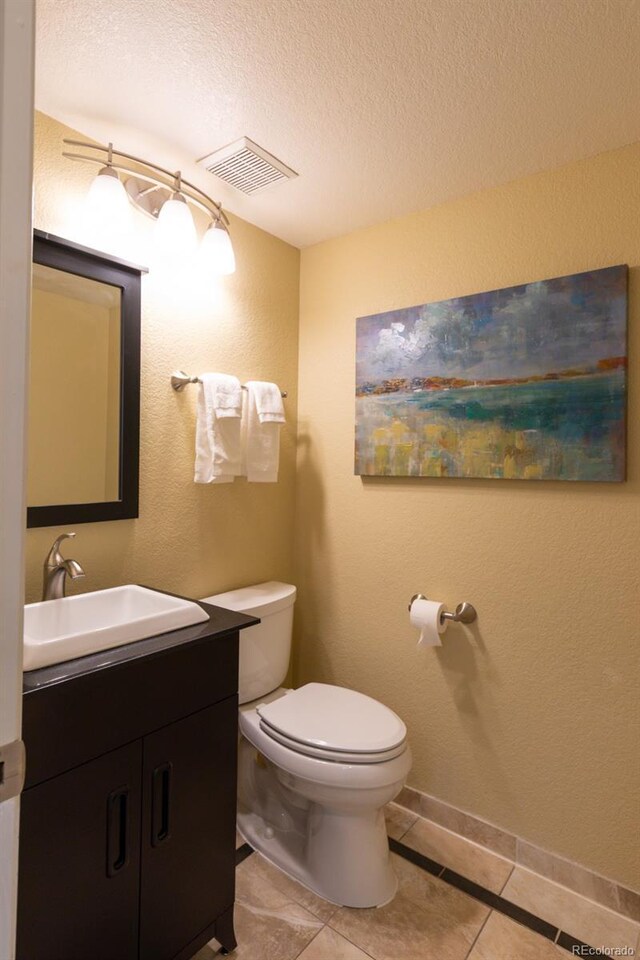 1881 Alma Ln, Superior, CO 80027 - bathroom featuring vanity, tile patterned floors, and a textured ceiling
