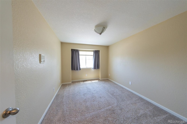 1881 Alma Ln, Superior, CO 80027 - carpeted spare room featuring a textured wall and a textured ceiling
