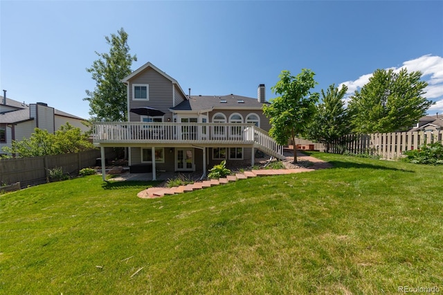 1881 Alma Ln, Superior, CO 80027 - back of house with a wooden deck, a fenced backyard, stairs, and a patio area