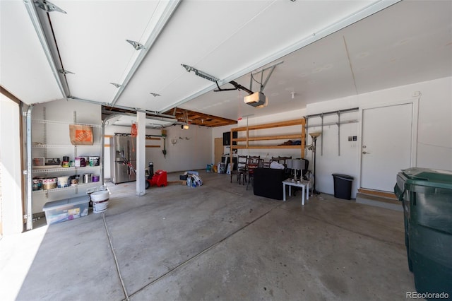 1881 Alma Ln, Superior, CO 80027 - garage with a garage door opener and stainless steel fridge with ice dispenser