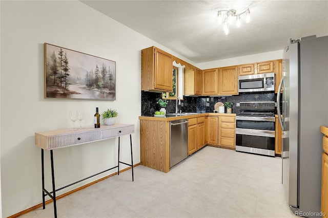 11333 Conifer Mountain Rd, Conifer, CO 80433 - kitchen featuring stainless steel appliances, backsplash, and a textured ceiling