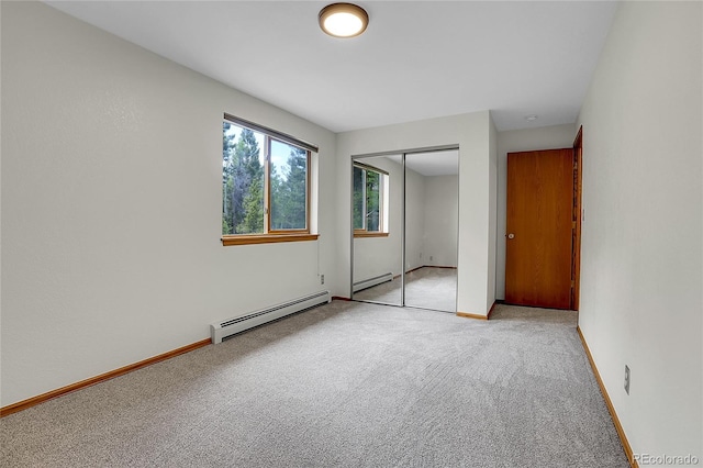 11333 Conifer Mountain Rd, Conifer, CO 80433 - unfurnished bedroom featuring baseboard heating, carpet, and a closet