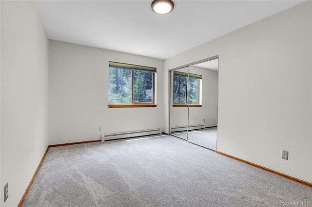 11333 Conifer Mountain Rd, Conifer, CO 80433 - carpeted spare room featuring baseboard heating and a baseboard radiator