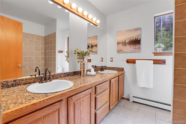 11333 Conifer Mountain Rd, Conifer, CO 80433 - bathroom with a baseboard radiator, double vanity, tile patterned floors, and a shower
