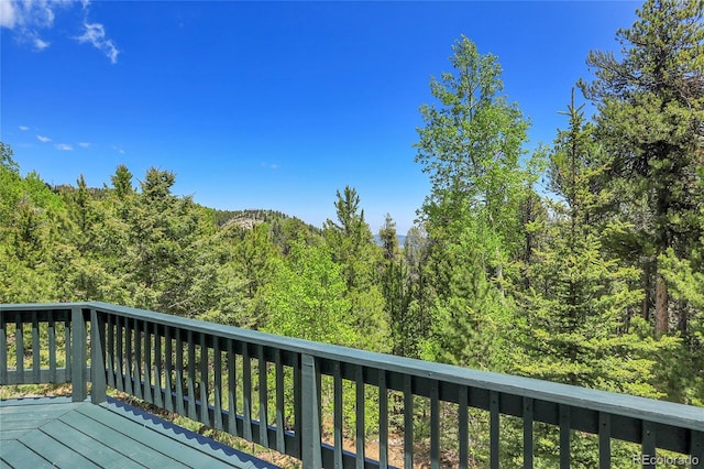 11333 Conifer Mountain Rd, Conifer, CO 80433 - wooden deck with a view of trees