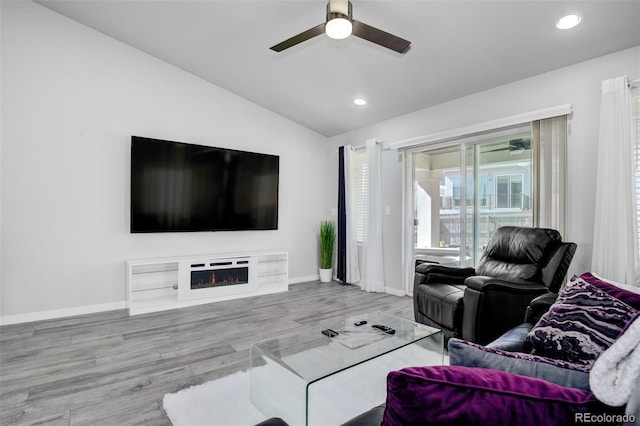 2742 Show Hunter Way, Colorado Springs, CO 80922 - living room featuring a ceiling fan, vaulted ceiling, recessed lighting, baseboards, and wood finished floors