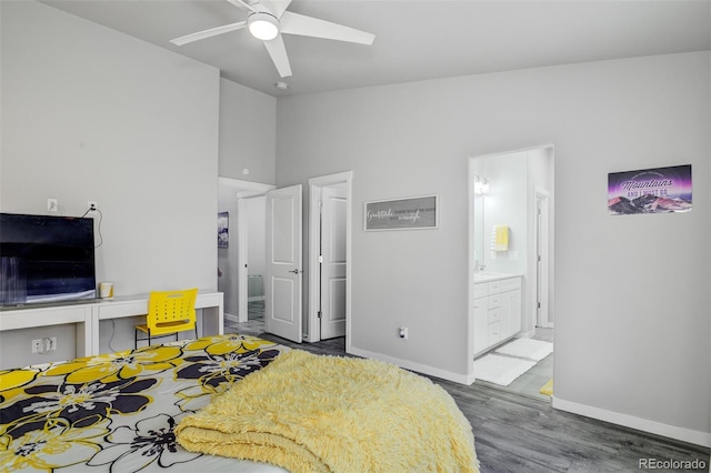 2742 Show Hunter Way, Colorado Springs, CO 80922 - bedroom featuring baseboards, wood finished floors, vaulted ceiling, connected bathroom, and a ceiling fan