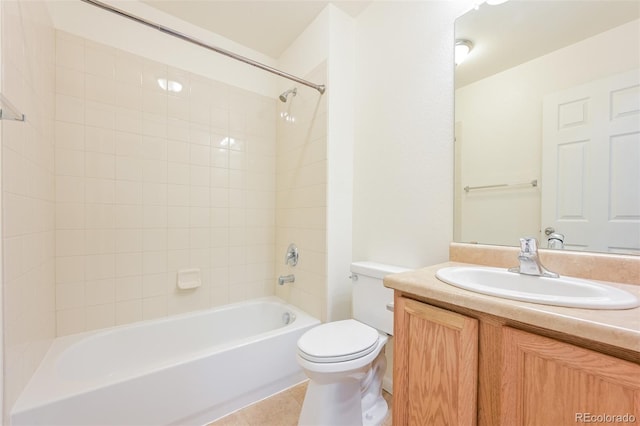 full bath with toilet, vanity, tile patterned flooring, and washtub / shower combination