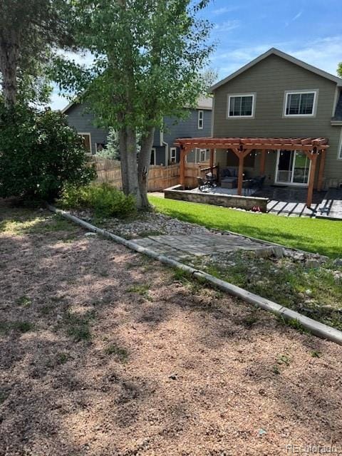 5201 E 127th Dr, Thornton, CO 80241 - rear view of property with a pergola and a patio area