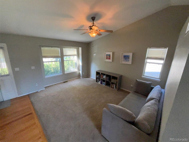 5201 E 127th Dr, Thornton, CO 80241 - living room featuring plenty of natural light, ceiling fan, lofted ceiling, and light colored carpet