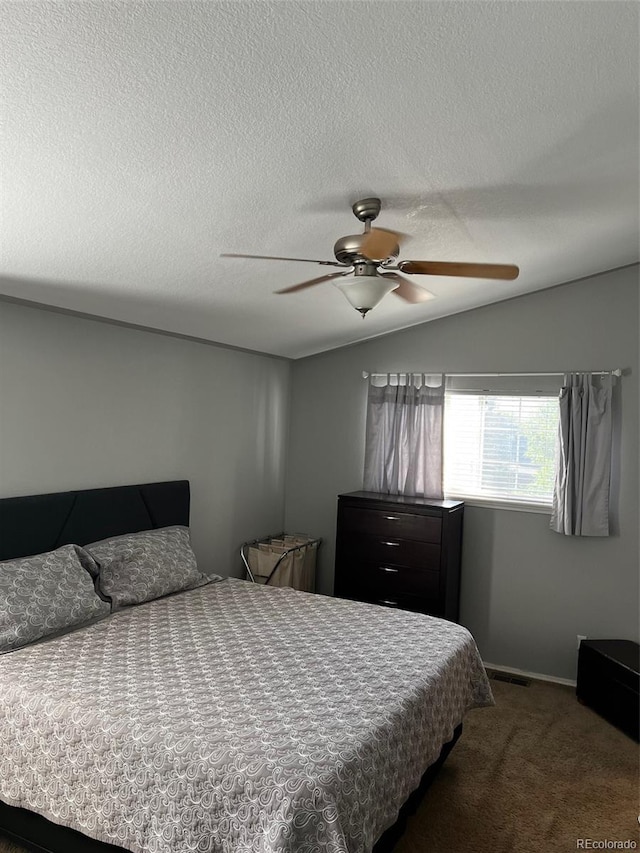 5201 E 127th Dr, Thornton, CO 80241 - carpeted bedroom with lofted ceiling, a ceiling fan, and a textured ceiling