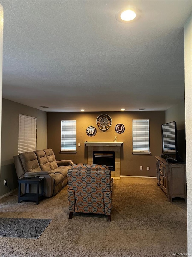 5201 E 127th Dr, Thornton, CO 80241 - living room featuring carpet flooring, a fireplace, and a textured ceiling