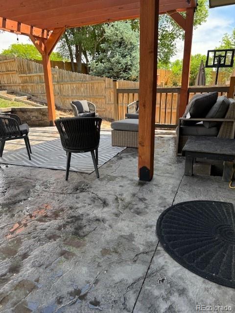 5201 E 127th Dr, Thornton, CO 80241 - fenced backyard featuring a patio