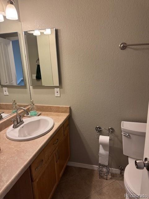 5201 E 127th Dr, Thornton, CO 80241 - bathroom with vanity and tile patterned flooring