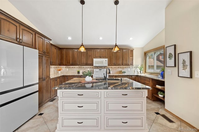 kitchen featuring open shelves, white appliances, dark stone countertops, lofted ceiling, and tasteful backsplash