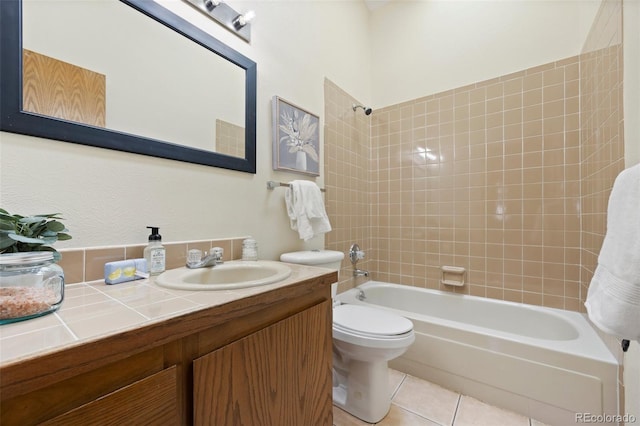 full bath with vanity, tile patterned flooring, toilet, and shower / tub combination