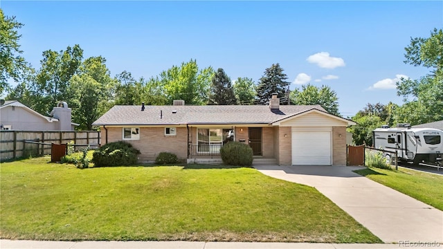 7135 S Sherman St, Centennial, CO 80122 - ranch-style house with covered porch, an attached garage, brick siding, concrete driveway, and a chimney